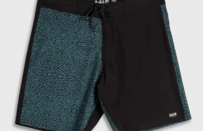 Black MAR boardshorts with turquoise patterned side panels on a grey background.